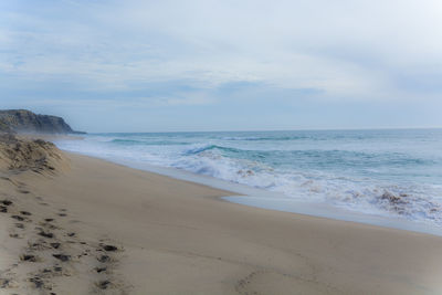 Scenic view of beach against sky