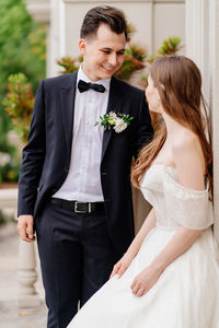 Bridegroom standing outdoors