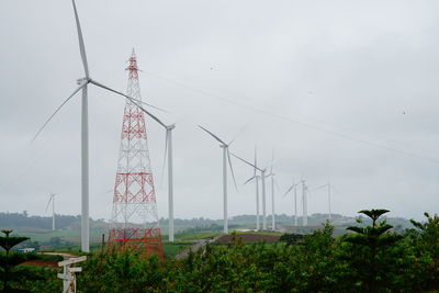 Low angle view of electricity pylon against sky