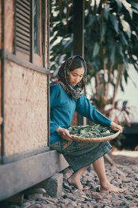 Side view of young woman looking away