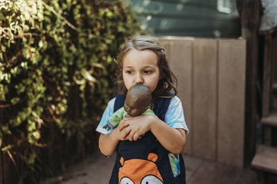 Portrait of a girl holding camera