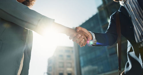 Cropped image of business people shaking hands