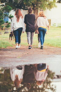 Rear view of couple walking outdoors