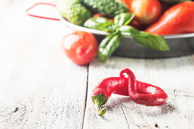 Close-up of red chili peppers on table