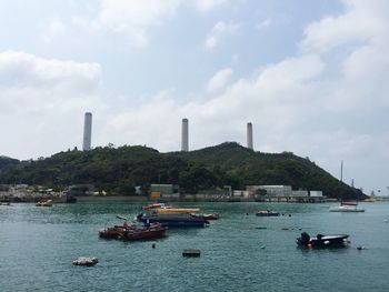 Boats moored on bay at yung shue wan