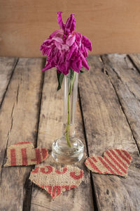 High angle view of pink flower vase on table