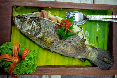 Close-up of fish on barbecue grill