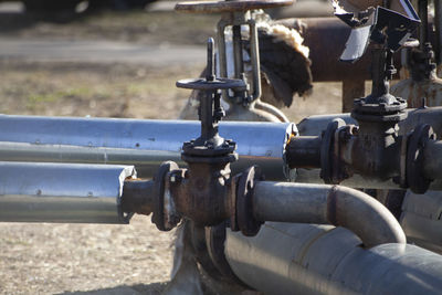 Pipes with hot and cold water on the street. gas communications above ground. 