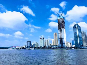 Modern buildings in city against sky