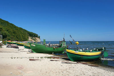 Fishing boats moored at beach