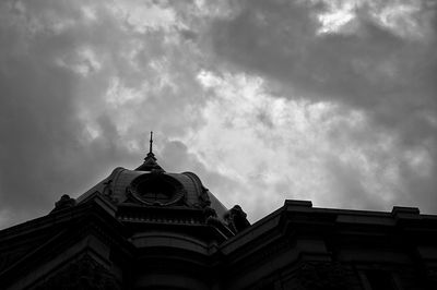 Low angle view of church against cloudy sky