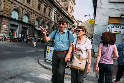 People walking on street in city