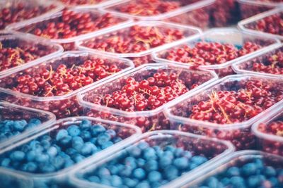 Full frame shot of berries in containers at market