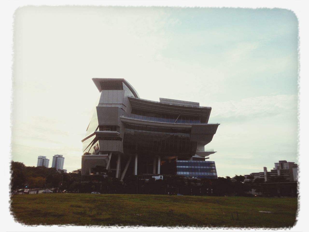 building exterior, architecture, built structure, sky, transfer print, auto post production filter, city, grass, building, outdoors, cloud - sky, day, residential structure, residential building, house, no people, copy space, field, tree, cloud