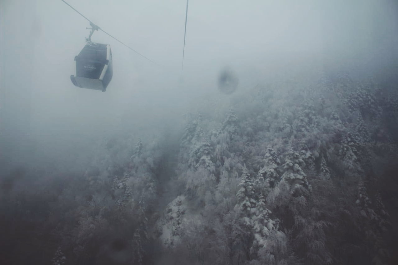 sea, water, nature, fog, cable car, overhead cable car, day, mode of transportation, transportation, motion, outdoors, high angle view, scenics - nature, beauty in nature, cold temperature, underwater, no people, travel