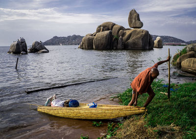 Man pulling boat ashore