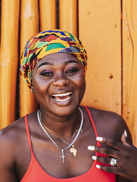 African woman with a hopeful happy smile and traditional headdress 