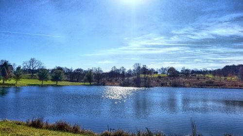 Scenic view of lake against blue sky