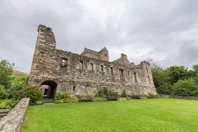 Old ruin building against cloudy sky