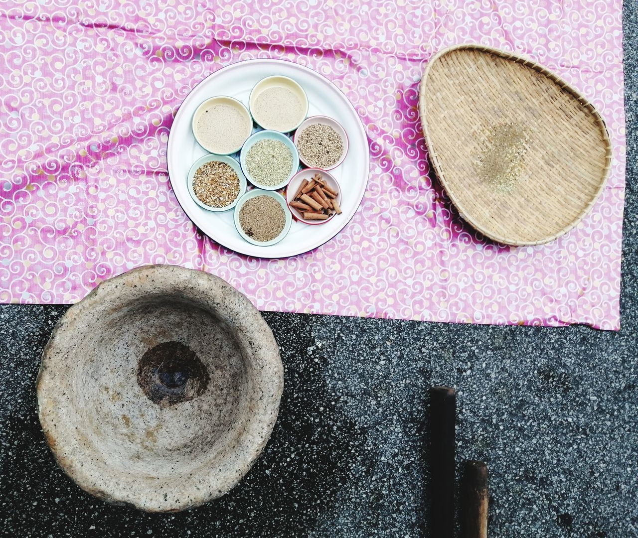 still life, high angle view, indoors, table, food and drink, no people, food, directly above, container, bowl, freshness, geometric shape, circle, day, pink color, sweet food, hat, plate, household equipment, indulgence