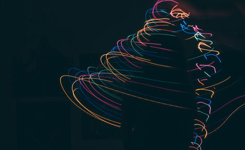 Low angle view of light trails at night