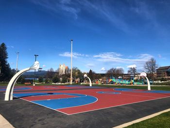 View of basketball hoop against blue sky