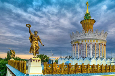 Statue of liberty against sky in city