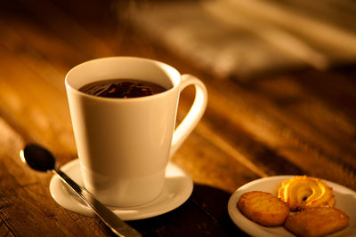 Close-up of coffee cup on table