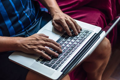 Close-up of a using his laptop in the quarantine period