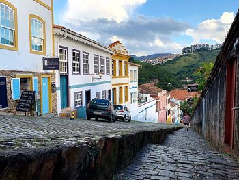 Street amidst buildings against sky