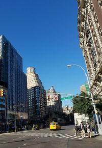 Low angle view of buildings against blue sky