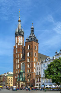 Saint mary's basilica is a brick gothic church adjacent to the main market square in kraków, poland