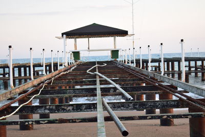 Staircase on beach against sky