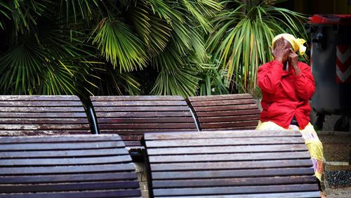 People relaxing on wood