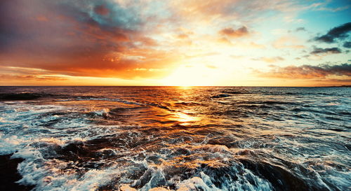 Scenic view of sea against sky during sunset