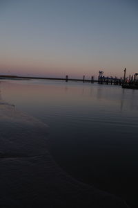 Scenic view of sea against clear sky during sunset