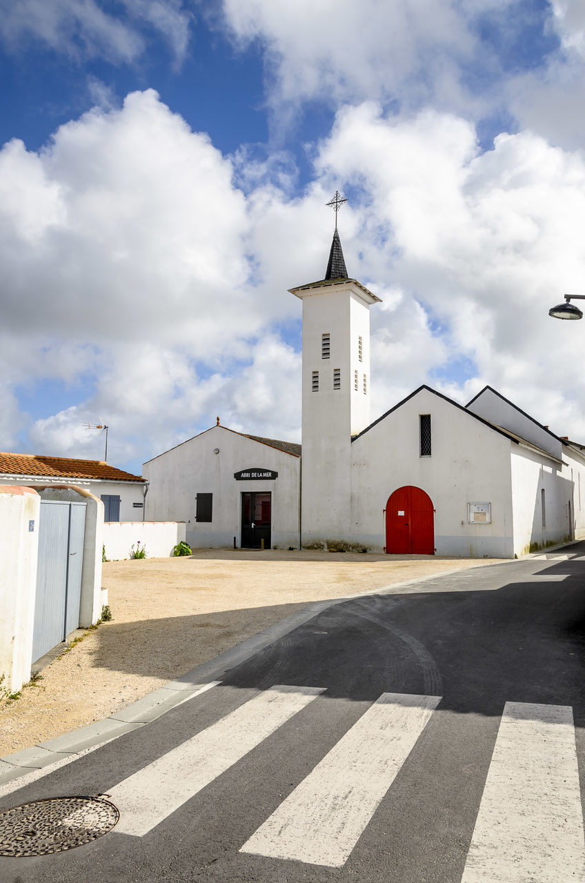 building exterior, built structure, architecture, cloud - sky, building, sky, place of worship, nature, religion, sunlight, road, day, belief, tower, spirituality, city, road marking, symbol, no people, outdoors