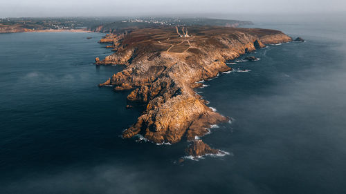 High angle view of rocks on sea