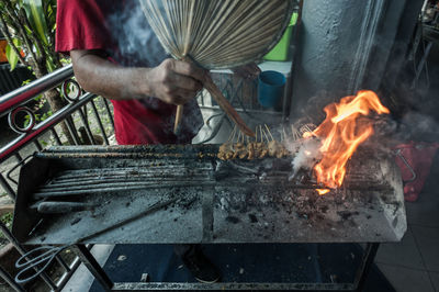 Close-up of man preparing food