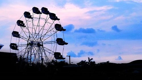 Low angle view of silhouette trees against sky at sunset