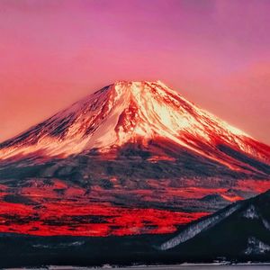 Majestic view of volcanic mountain against sky during sunset