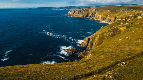 Waves crashing on the rocks of the coast aerial view