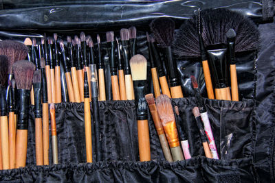 Close-up of make-up brushes in black package