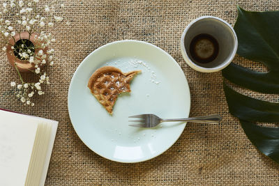 High angle view of coffee served on table