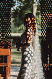 Portrait of woman standing outdoors