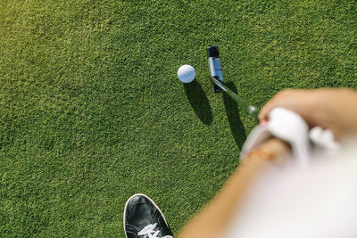 Low section of person on golf ball