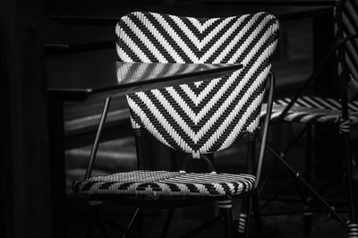 Close-up of empty chair by table