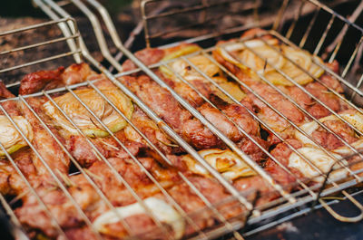 Top view on grill with meat. cooking delicious food. grilled meat with spices and vegetables.