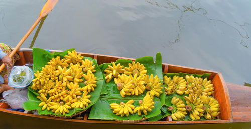 High angle view of yellow flowers in container