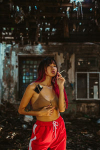 Young woman standing outdoors
